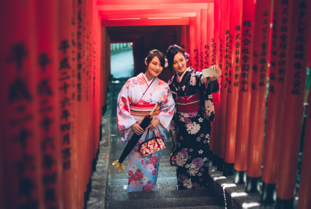 Two japanese girls wearing kimonos traditional clothes, lifestyle momentsのeditorial素材