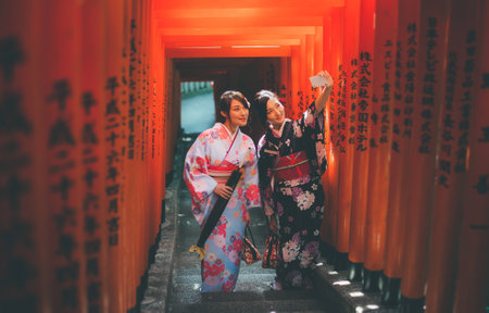 Two japanese girls wearing kimonos traditional clothes, lifestyle momentsのeditorial素材