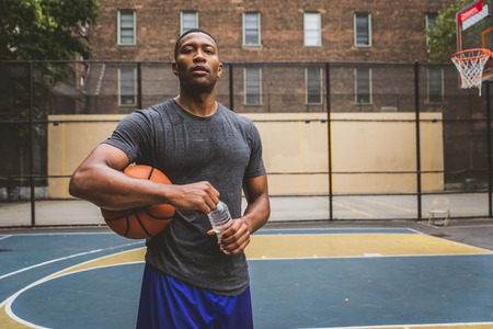 Basketball player training on a court in New york cityの写真素材