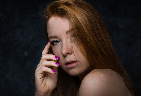 Portrait of pretty  woman in a studio for a beauty session - Beautiful girl posing on colored backgroundの写真素材
