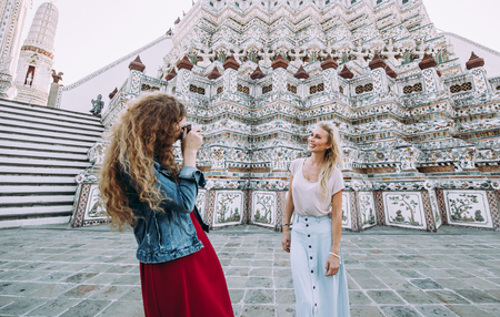 Couple of beautiful girls visiting bangkok main attractionsの写真素材