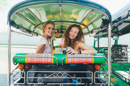 Couple of beautiful girls visiting bangkok main attractionsの写真素材