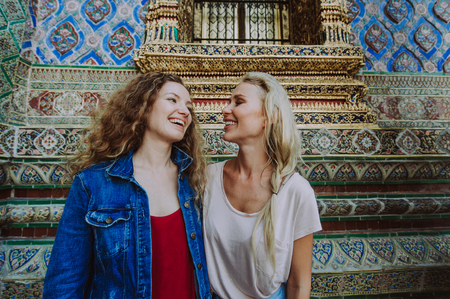 Couple of beautiful girls visiting bangkok main attractionsの写真素材