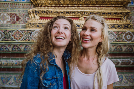 Couple of beautiful girls visiting bangkok main attractionsの写真素材