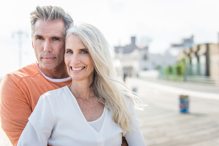 Beautiful happy senior couple dating outdoors - Youthful married couple having fun and enjoying life togetherの写真素材