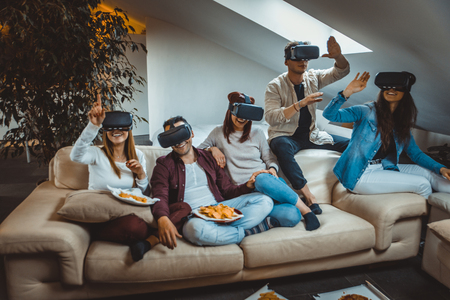 Group of happy friends bonding at home - Young adults having party and doing various activitiesの写真素材