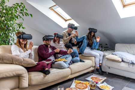 Group of happy friends bonding at home - Young adults having party and doing various activitiesの写真素材