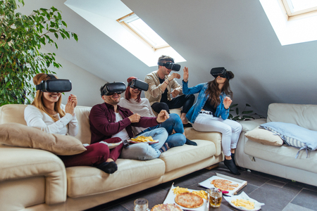 Group of happy friends bonding at home - Young adults having party and doing various activitiesの写真素材