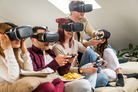 Group of happy friends bonding at home - Young adults having party and doing various activitiesの写真素材