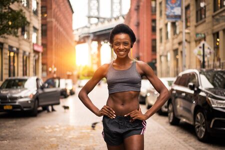 Young fitness woman running in New York - Sportive girl training outdoors, concepts about sport and healthy lifestyleの写真素材