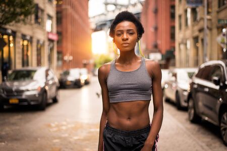 Young fitness woman running in New York - Sportive girl training outdoors, concepts about sport and healthy lifestyleの写真素材