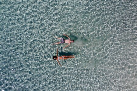 Couple enjoying time  in front of the beach in Coron. Concept about summer, lifestyle,wanderlust...