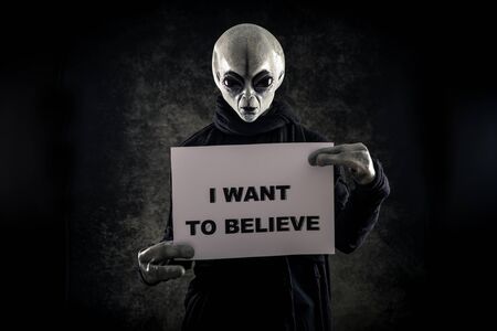 Alien creature has a message for humans. Grey kind humanoid from an other planet portrait series.の写真素材