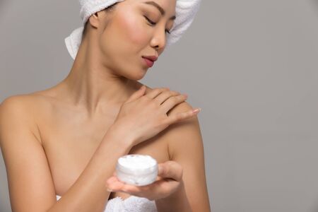 Beautiful asian woman portrait isolated on neutralの写真素材