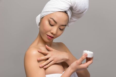 Beautiful asian woman portrait isolated on neutralの写真素材