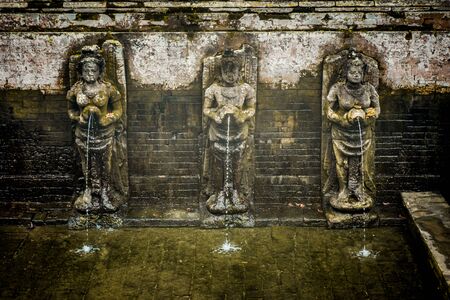 Statues of the a balinese temple Goa Gajah, Elephant Cave in Bali