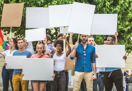 Group of activists is protesting outdoorsの写真素材
