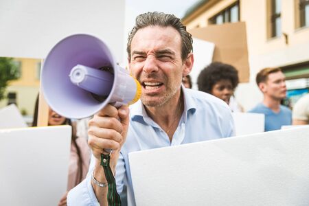 Group of activists is protesting outdoorsの写真素材