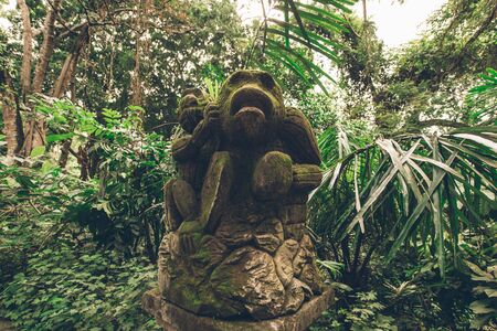 Statue in the sacred Monkey Forest, Ubud, Bali, Indonesiaの写真素材