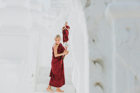 MANDALAY, HSINBYUME PAGODA, MYANMAR . MARCH 1ST 2019. Children monks spending time together at the...