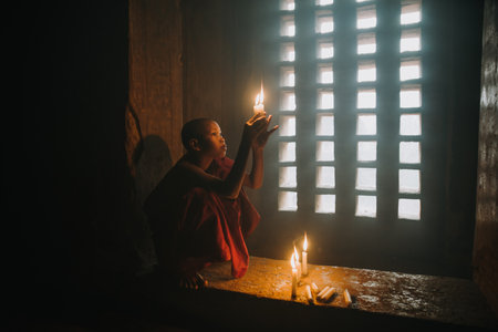 Foto de BAGAN, MYANMAR. 28TH FEBRUARY 2019. Portrait of  local little buddhist monks. In myanmar childrens start training for becoming monks at the age of 7 - Imagen libre de derechos