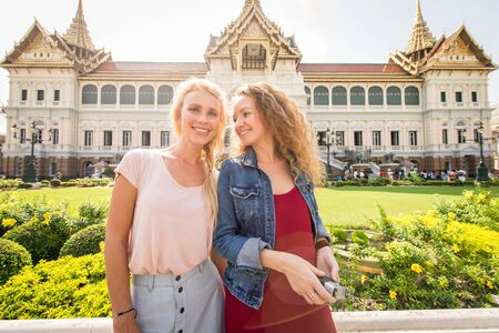 Beautiful women visiting Bangkok attractions and landmarks in Thailand - Young happy tourists...