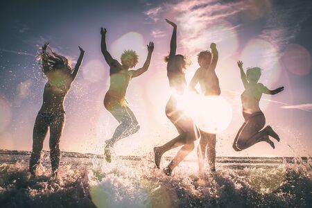 Group of friends having fun on the beachの写真素材