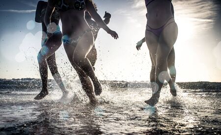 Group of friends having fun on the beachの写真素材