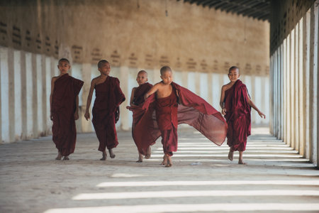 MANDALAY, MYANMAR . MARCH 1ST 2019. Children monks spending time together. In myanmar childrens start the training to become monks at the age of sevenのeditorial素材