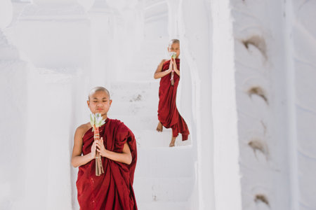 MANDALAY, HSINBYUME PAGODA, MYANMAR . MARCH 1ST 2019. Children monks spending time together at the pagoda. In myanmar childrens start the training to become monks at the age of sevenのeditorial素材