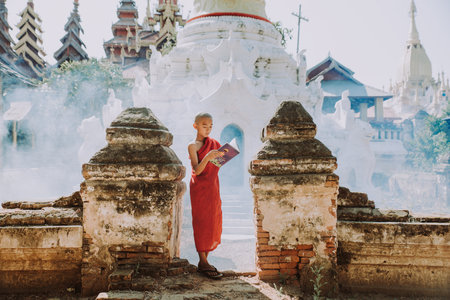 BAGAN, MYANMAR. 28TH FEBRUARY 2019. Portrait of  local little buddhist monks. In myanmar childrens start training for becoming monks at the age of 7のeditorial素材