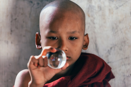 MANDALAY, MYANMAR . MARCH 1ST 2019. Children monks spending time together. In myanmar childrens start the training to become monks at the age of sevenのeditorial素材