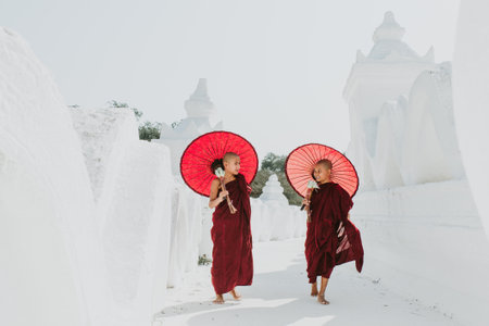 MANDALAY, HSINBYUME PAGODA, MYANMAR . MARCH 1ST 2019. Children monks spending time together at the pagoda. In myanmar childrens start the training to become monks at the age of sevenのeditorial素材