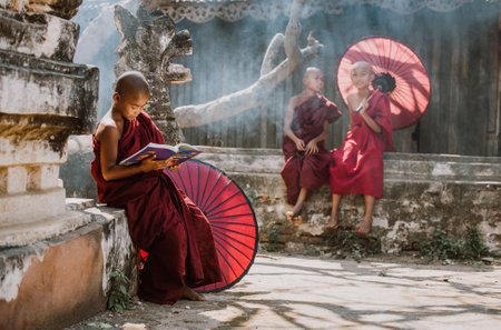 BAGAN, MYANMAR. 28TH FEBRUARY 2019. Portrait of  local little buddhist monks. In myanmar childrens start training for becoming monks at the age of 7のeditorial素材