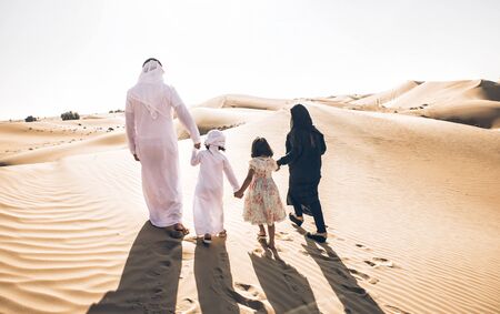 Happy family spending a wonderful day in the desertの写真素材