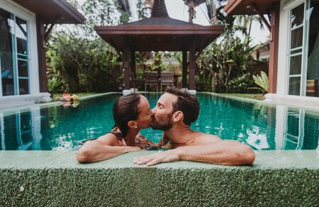 Happy couple spending time in a beautiful vacation houseの写真素材