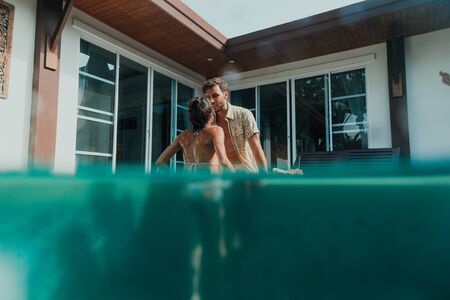 Happy couple spending time in a beautiful vacation house