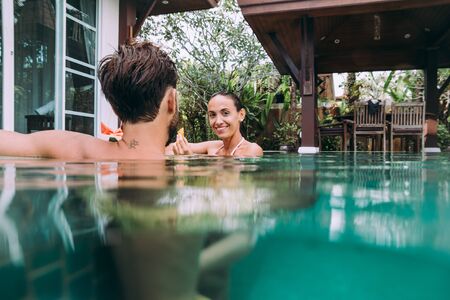 Happy couple spending time in a beautiful vacation house