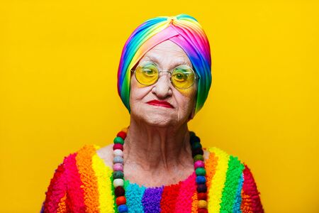 Funny grandmother portraits.granny fashion model on colored backgroundsの写真素材