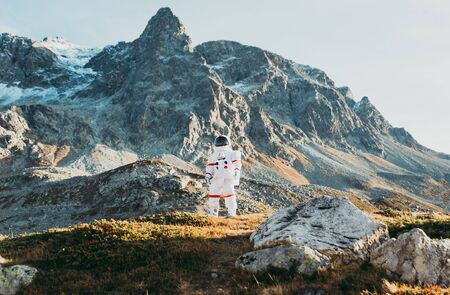 Astronaut exploring a new planet. Searching for a new home for humanity. Concept about science and natureの写真素材