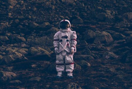 Astronaut exploring a new planet. Searching for a new home for humanity. Concept about science and natureの写真素材