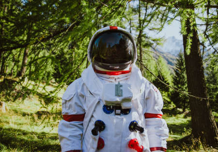 Astronaut exploring a new planet. Searching for a new home for humanity. Concept about science and natureの写真素材