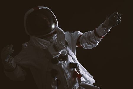 Astronaut leaving earth. Searching for a new home for humanity. Concept about science and nature....