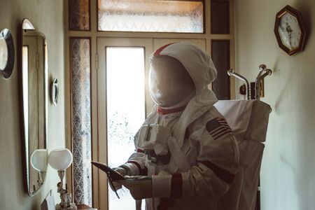 Astronaut coming back on earth after long time it s been abandoned. Concept about science and scifi