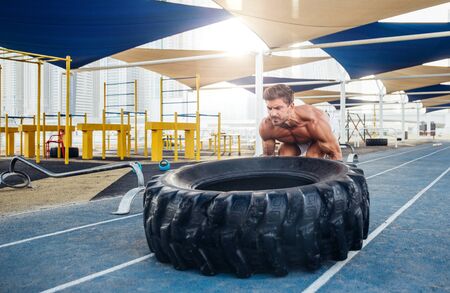 man doing work out and different exercises outdoorの写真素材