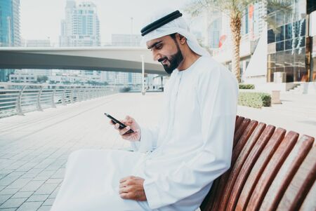 Beautiful middle eastern man wearing kandora traditional outfit in Dubai. Portraits in the emirates