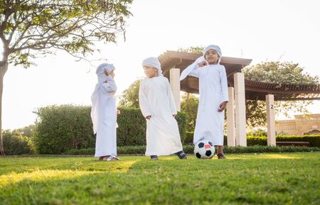Group of middle-eastern kids playing and having fun outdoors