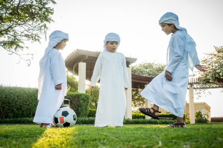 Group of middle-eastern kids playing and having fun outdoors