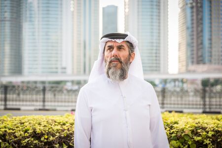 Middle-eastern senior man with traditional kandora in Dubai