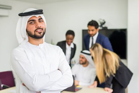 Multiracial group of business people having a meeting in a office - Teamwork in the office, business meeting in the UAEの写真素材